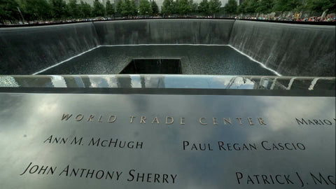 names tilting up to Freedom Tower at 911 Museum on beautiful summer day in New York City