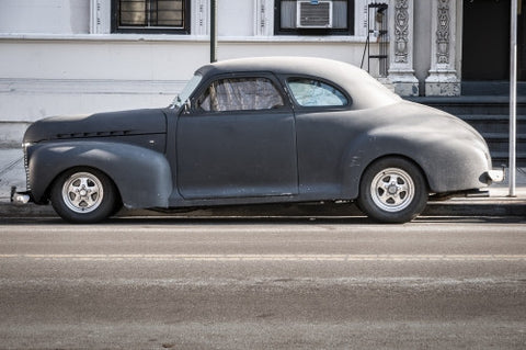 classic sedan from the 40s parked on Park Avenue - old fashioned car in Manhattan