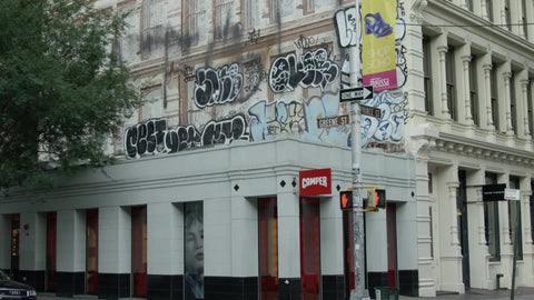 graffiti on wall in SoHo at Greene Street, zooming in on spray paint pieces in 4K downtown