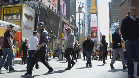 kid breakdancing in Times Square on bright sunny day - 4K slow motion