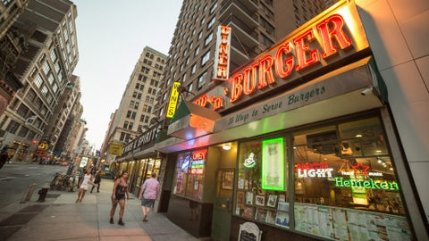 Cozy Burger on Astor Place and Broadway in early evening in summer