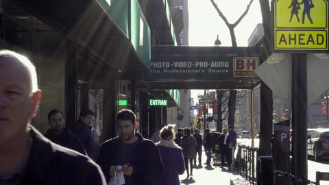 People walking outside B&H Photo Superstore, exterior shot on 9th Ave in NYC