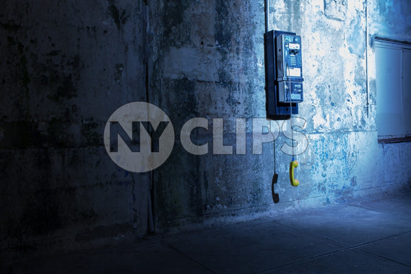 gritty dirty dangling public payphone in subway station in Brooklyn - off the hook