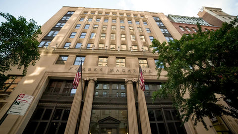 Forbes Magazine Building tilting down to front doors on Lower 5th Ave in Manhattan