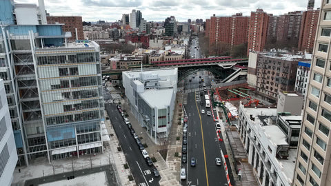 aerial over elevated subway train track 125th street Harlem NYC