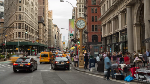 5th Avenue clock and Flatiron Building street view time-lapse from day to night in 4K and 1080 HD in NYC