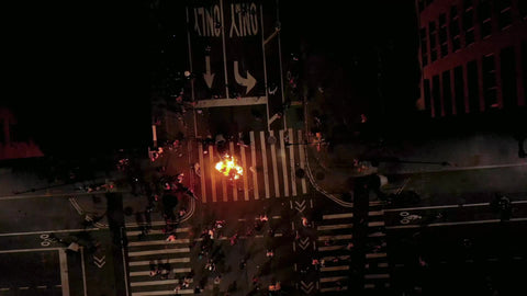 lowering over fire in riot protestors