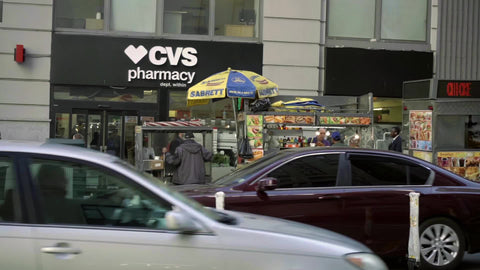 food truck across street cars driving traffic 34th street Manhattan New York City NYC