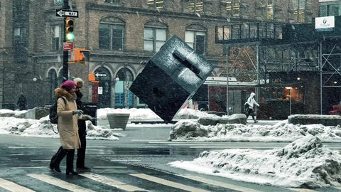 couple walking in snow blizzard in Cooper Square snowing in winter Manhattan New York City NYC 1080