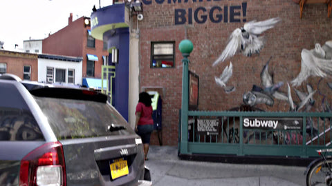 famous rapper Notorious B.I.G. mural on Brooklyn Love Building above subway station