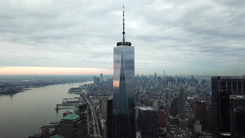 Freedom Tower high aerial circling with Manhattan buildings cityscape New York City NYC