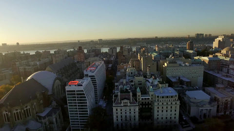 aerial of buildings in Harlem - sunset over Uptown Manhattan in NYC