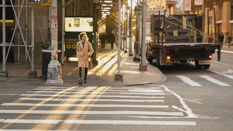 woman crossing street in Downtown Manhattan early morning New York City NYC