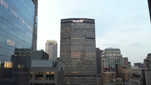 pulling out backwards aerial from MetLife Building and skyscrapers Manhattan New York City NYC