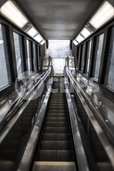 down escalator exiting 1 2 and 3 train in Harlem subway station