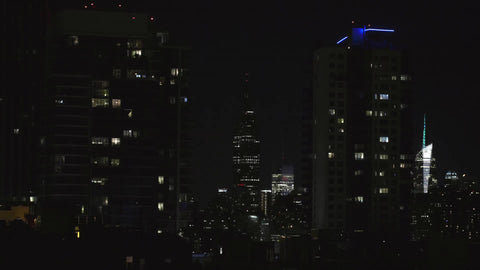 Empire State Building lighting up at night in Manhattan NYC