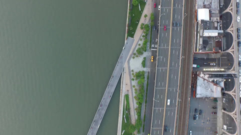aerial of taxicab driving in traffic on Westside Highway by Hudson River