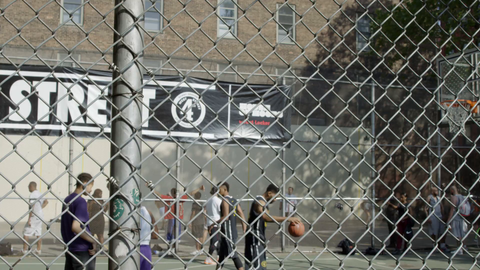 kid scores layup in practice at West 4th Street basketball courts on 6th Ave - slow motion 4K in Manhattan NYC