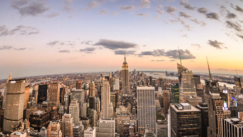 round fisheye wide angle view of Empire State Building and Manhattan cityscape at beautiful sunset - 4K skyscrapers tilting down