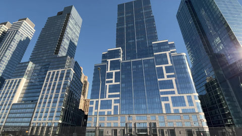 tall glass buildings on Riverside Boulevard - blvd of skyscrapers towers over West Side Highway cars driving view Manhattan New York City NYC