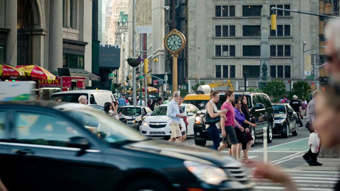 busy intersection on 23rd Street and 5th Ave on summer day in Manhattan