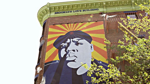 Biggie mural on Brooklyn Building above subway station