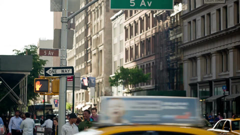 5th Ave sign on 14th Street on sunny day on Manhattan summer day - busy intersection