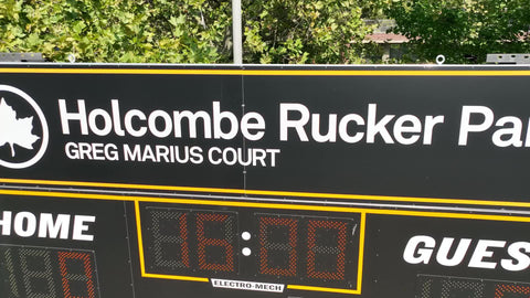 Holcombe Rucker Park scoreboard sign close-up backing up in Harlem New York City NYC