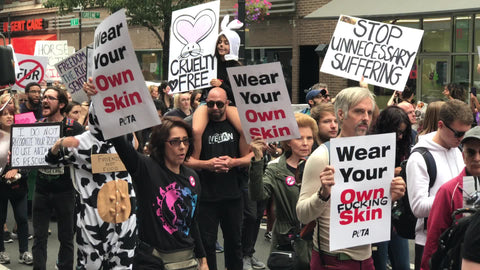 wear your own skin sign at cruelty protest for animal rights in New York City