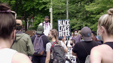 What does change mean? Leader giving speech at Black Lives Matter rally in Washington Square Park speaking before crowd of activists in New York City with audio