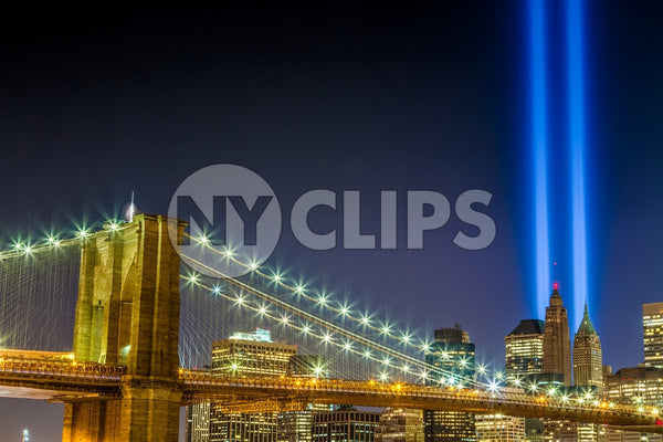 911 lights over Manhattan and Brooklyn Bridge at night