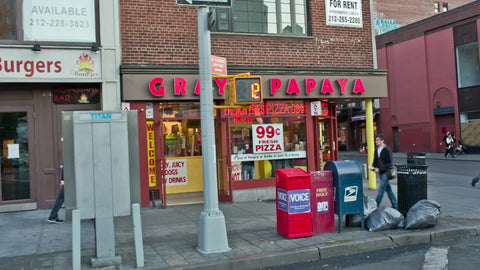 crossing street toward Gray's Papaya on 8th Street and 6th Ave in Greenwich Village