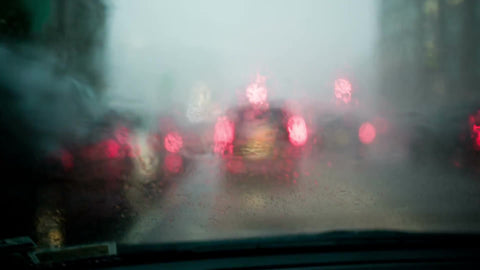 rainy windshield during rain storm from driver pov - driving with wipers wiping away drops on glass - raining with audio