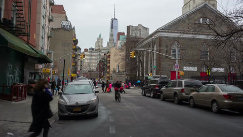 street in Chinatown in winter with Freedom Tower in background - Downtown Manhattan