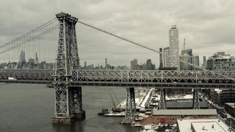 aerial of cars driving on Williamsburg Bridge from Brooklyn New York City NYC