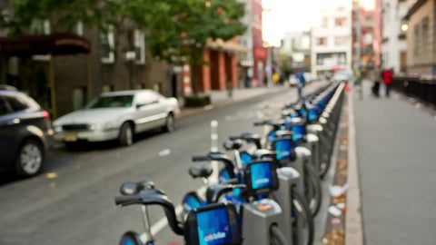CitiBikes parked at station in long line