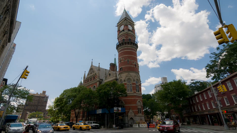wide shot of Jefferson Market Library clock tower in Greenwich Village - 4K timelapse in Manhattan NYC