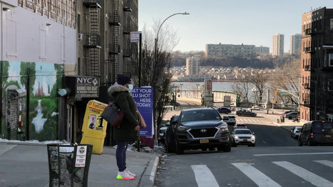 pizza shops and stores people on Broadway driving in Harlem Uptown New York City NYC