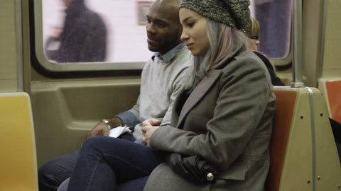 woman and man on train - couple riding subway in winter