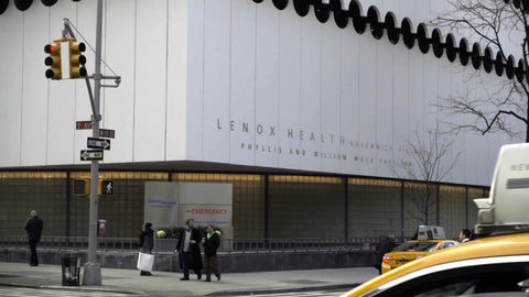 taxi cab driving in traffic with cars - Lennox Health Pavilion - hospital in West Village in NYC