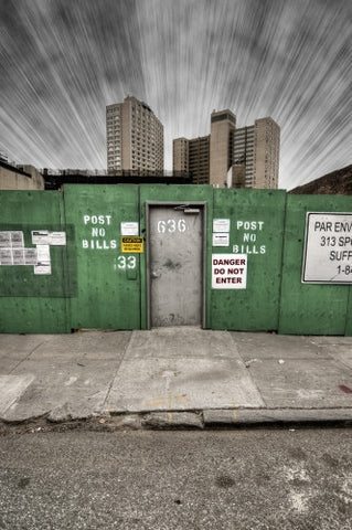 boarded up construction site - danger do not enter and post no bills sign