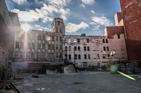 poverty stricken Harlem courtyard in Uptown Manhattan ghetto - broken down abandoned building