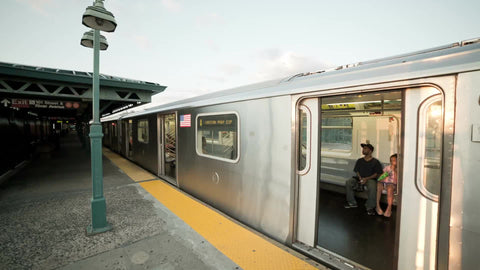 4 Train leaving 161st st subway station at Yankee Stadium - elevated platform in the Bronx NYC