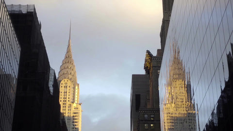 Chrysler Building reflection against glass building Midtown Manhattan New York City NYC