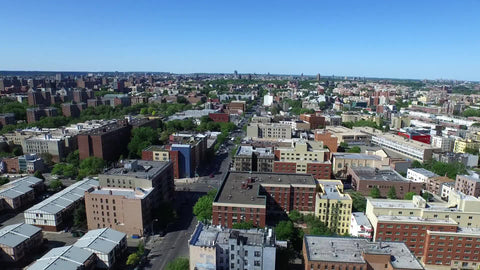aerial of housing projects, low lying houses and buildings in poverty stricken section of the Bronx