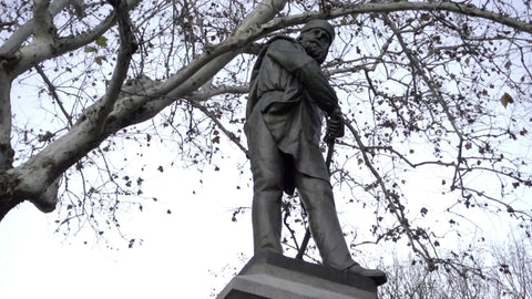 zooming out from Garibaldi statue in Washington Square Park on winter day