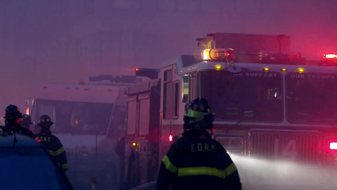 firetruck emergency vehicle flashing lights at night in smoke at night with FDNY firefighters in slow motion 4K and 1080 HD in NYC