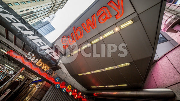 Times Square subway sign on 8th Ave in Manhattan - bright lights overwhelming train station