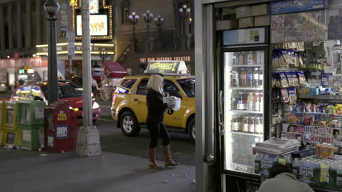 news stand on 42nd st at night
