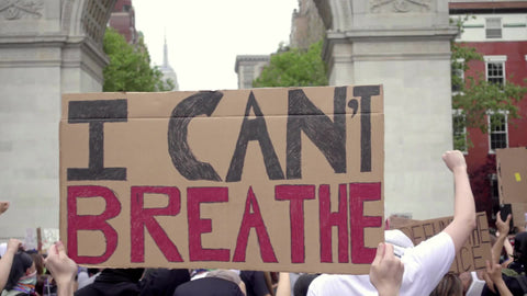 I Can't Breathe sign commemorating Eric Garner and George Floyd at Black Lives Matter rally in Washington Square Park in New York City